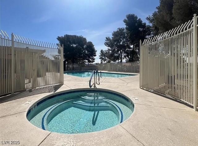 640 Thornewood Pl, Las Vegas, NV 89123 - community pool featuring a hot tub and a patio area