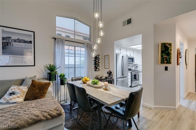 640 Thornewood Pl, Las Vegas, NV 89123 - dining space featuring a high ceiling and light wood-style floors