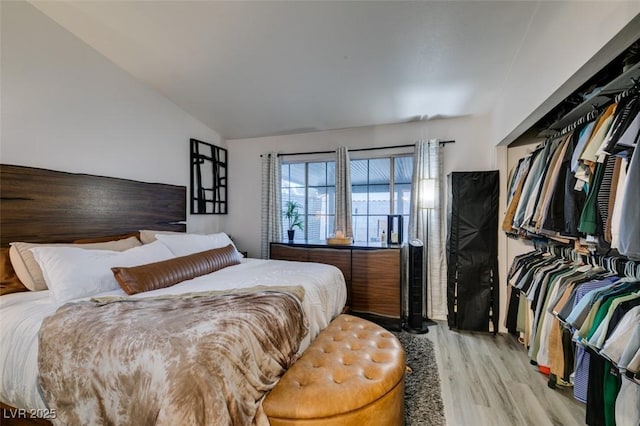 640 Thornewood Pl, Las Vegas, NV 89123 - bedroom featuring light wood finished floors and vaulted ceiling