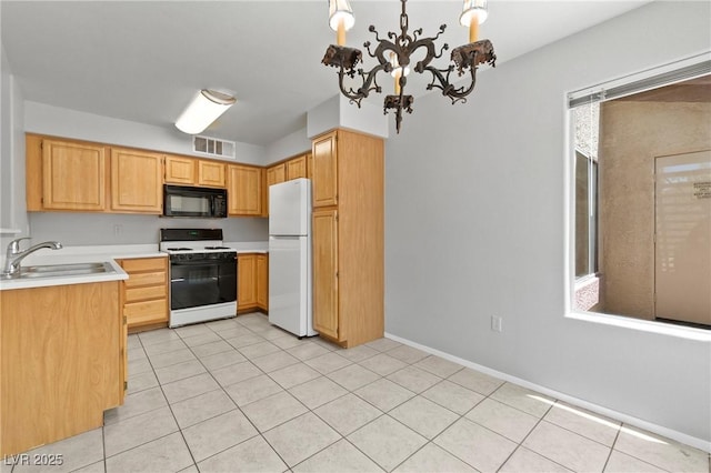 5710 E Tropicana Ave Unit 1184, Las Vegas, NV 89122 - kitchen with white appliances, light countertops, a chandelier, light tile patterned flooring, and light brown cabinets