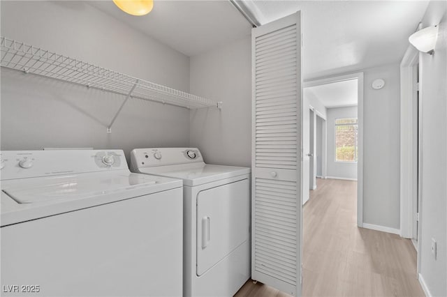 5710 E Tropicana Ave Unit 1184, Las Vegas, NV 89122 - laundry area featuring independent washer and dryer and light wood finished floors