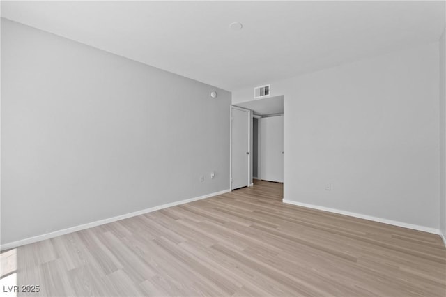 5710 E Tropicana Ave Unit 1184, Las Vegas, NV 89122 - empty room with light wood finished floors and baseboards