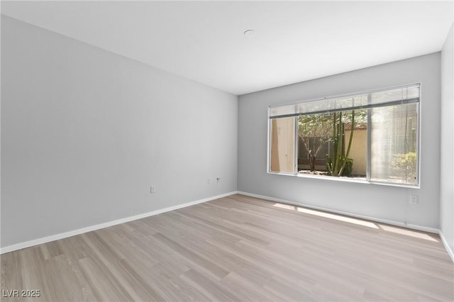 5710 E Tropicana Ave Unit 1184, Las Vegas, NV 89122 - unfurnished room with wood finished floors and baseboards