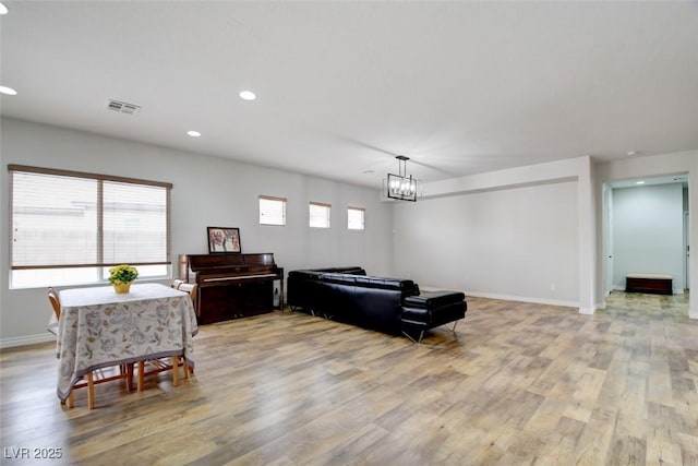 2766 Mintlaw Ave, Henderson, NV 89044 - living area featuring light wood-type flooring, a chandelier, and recessed lighting