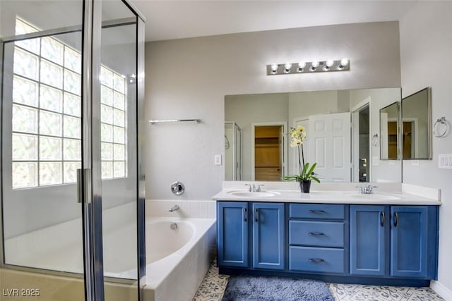 2766 Mintlaw Ave, Henderson, NV 89044 - full bath featuring double vanity, a bath, a stall shower, and tile patterned floors