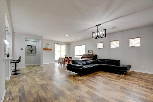 2766 Mintlaw Ave, Henderson, NV 89044 - living area with wood finished floors, a chandelier, and recessed lighting
