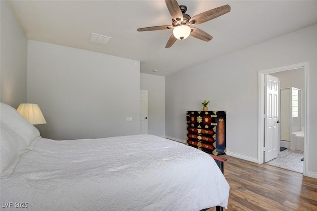 2766 Mintlaw Ave, Henderson, NV 89044 - bedroom with wood finished floors, connected bathroom, and a ceiling fan