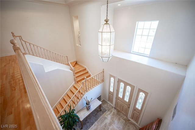 8925 Wild Creek Ct, Las Vegas, NV 89117 - foyer entrance featuring healthy amount of natural light, stairway, and a high ceiling