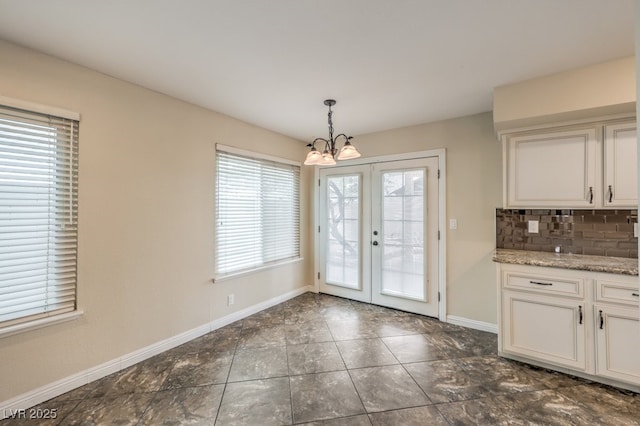 56 Westheimer Rd, Henderson, NV 89074 - unfurnished dining area featuring a chandelier and french doors