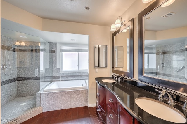 56 Westheimer Rd, Henderson, NV 89074 - full bath with a bath, a stall shower, double vanity, and wood finished floors
