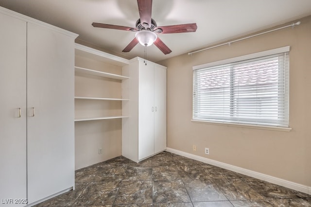 56 Westheimer Rd, Henderson, NV 89074 - unfurnished bedroom with dark stone finish floors and ceiling fan