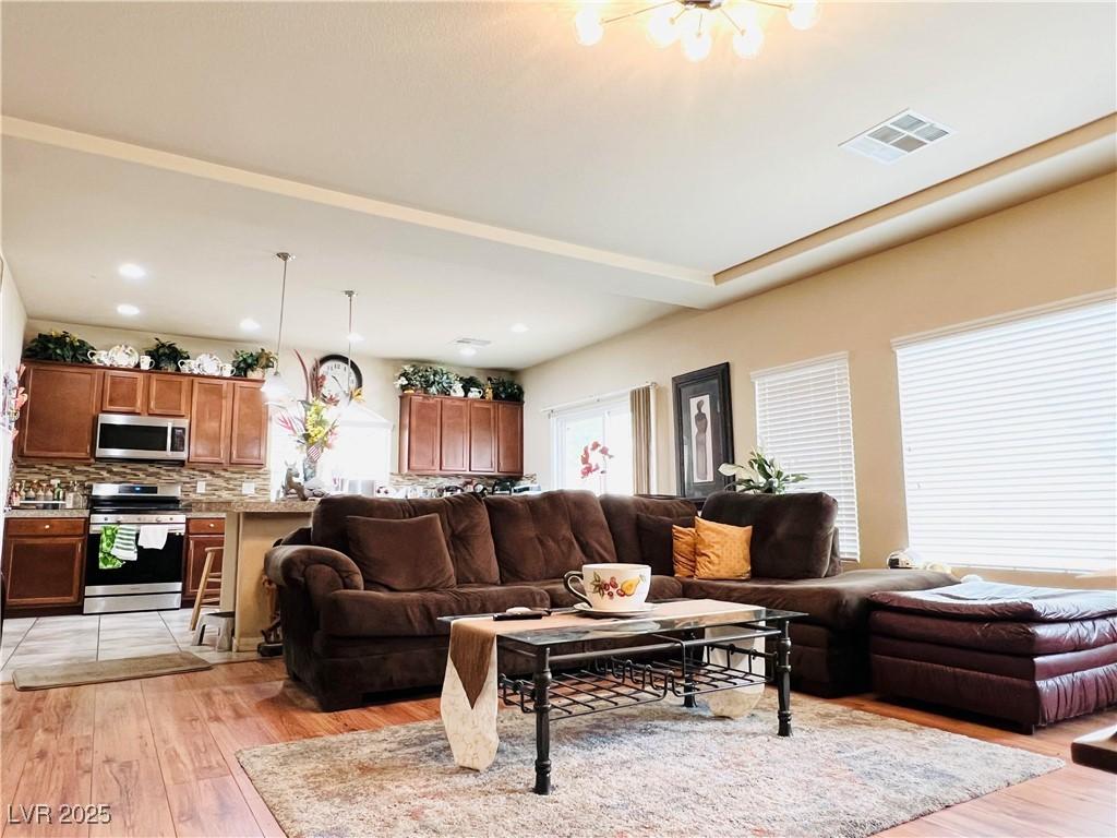 5932 Pillar Rock Ave, Las Vegas, NV 89139 - living room featuring light wood-type flooring