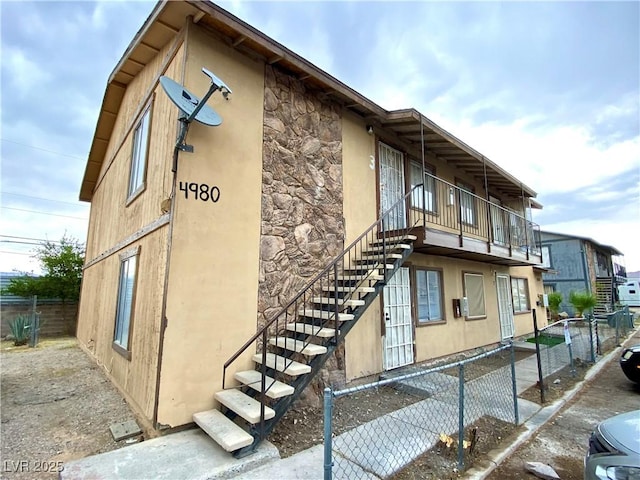 4980 Apollostar Ct, Las Vegas, NV 89115 - view of building exterior with stairway