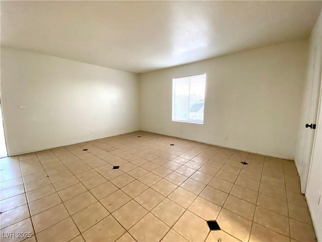 4980 Apollostar Ct, Las Vegas, NV 89115 - spare room featuring light tile patterned floors