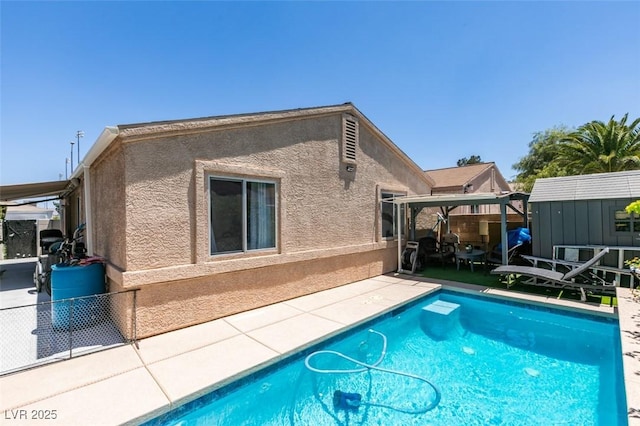1949 King Hill St, Las Vegas, NV 89106 - rear view of property with a patio, a shed, stucco siding, and a gazebo