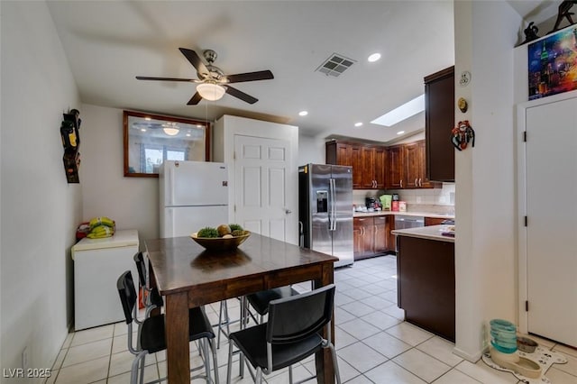 1949 King Hill St, Las Vegas, NV 89106 - kitchen featuring stainless steel fridge, freestanding refrigerator, fridge, ceiling fan, and light countertops
