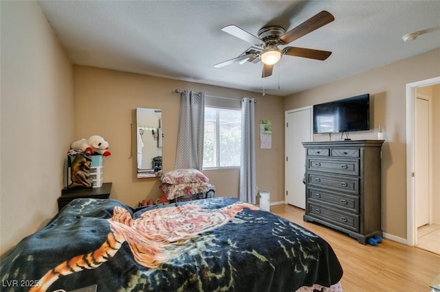 1949 King Hill St, Las Vegas, NV 89106 - bedroom with light wood-style floors and a ceiling fan