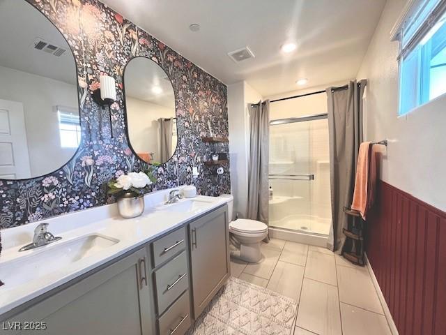 302 Bay Village Pl, Henderson, NV 89011 - full bath with wallpapered walls, a stall shower, plenty of natural light, double vanity, and wainscoting