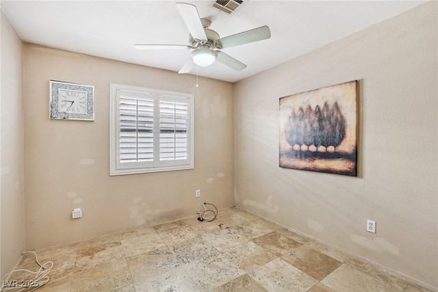 5580 Lonesome Biker Ln, Las Vegas, NV 89113 - unfurnished room with stone finish flooring and ceiling fan