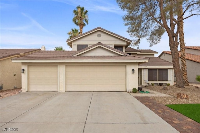 2344 Valleywood St, Henderson, NV 89014 - traditional-style home with concrete driveway, an attached garage, stucco siding, and a tile roof