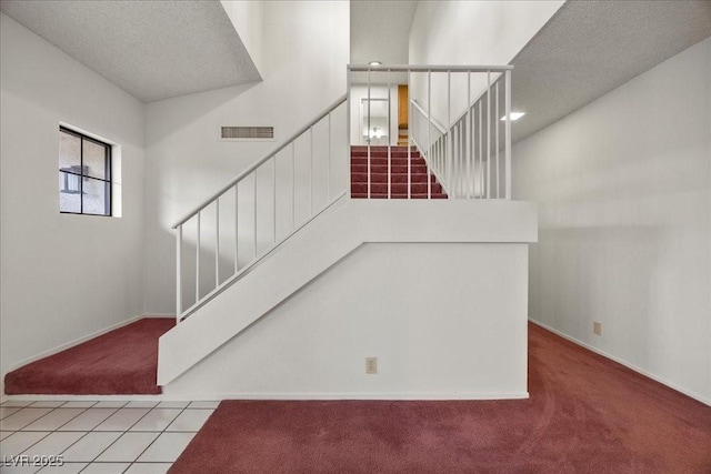 2344 Valleywood St, Henderson, NV 89014 - stairway with carpet floors and a textured ceiling