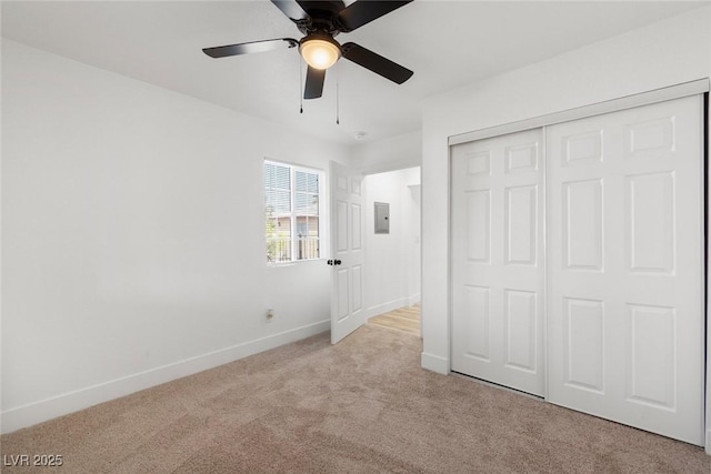 732 N 9th St, Las Vegas, NV 89101 - unfurnished bedroom with electric panel, carpet, a closet, and ceiling fan