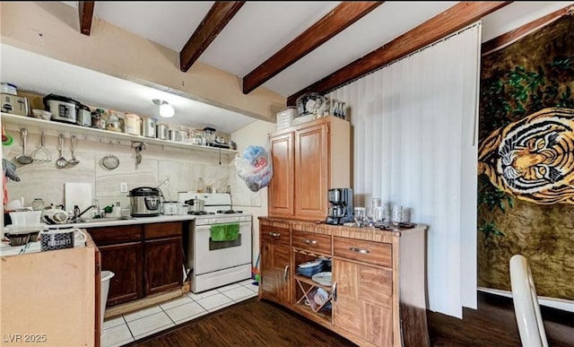 824 Salem Dr, Las Vegas, NV 89107 - kitchen with white range with gas cooktop, open shelves, beamed ceiling, light countertops, and wood finished floors