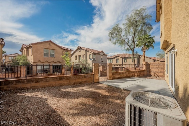 1161 Gecko Rd, Henderson, NV 89002 - rear view of house featuring a residential view, stucco siding, a gate, and a patio