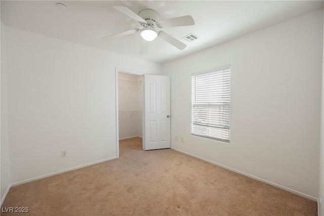 1161 Gecko Rd, Henderson, NV 89002 - unfurnished bedroom with light carpet, a spacious closet, a closet, and ceiling fan