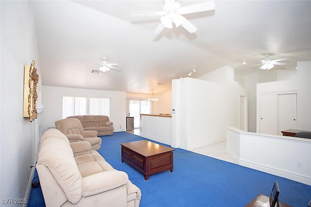 6249 Halehaven Dr, Las Vegas, NV 89110 - living room with lofted ceiling, ceiling fan, carpet, rail lighting, and a chandelier