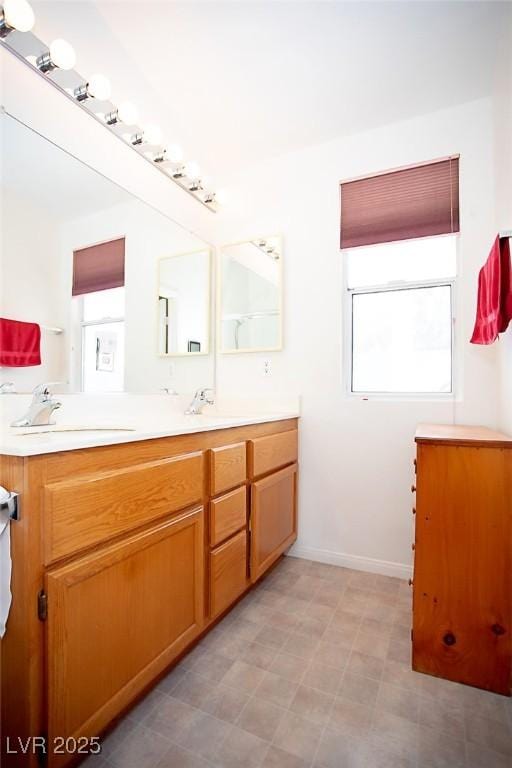 6249 Halehaven Dr, Las Vegas, NV 89110 - full bathroom with double vanity and tile patterned floors