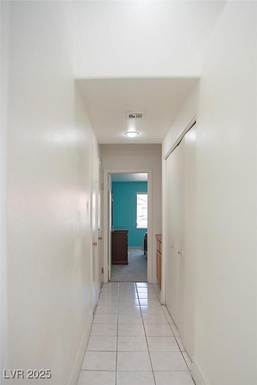 6249 Halehaven Dr, Las Vegas, NV 89110 - hall with light tile patterned floors and baseboards