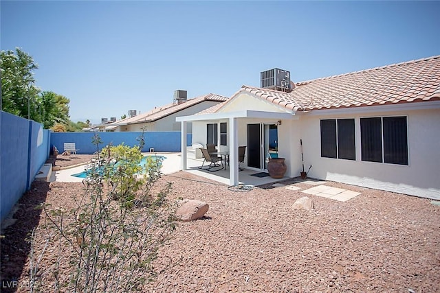 6249 Halehaven Dr, Las Vegas, NV 89110 - rear view of house featuring a fenced backyard, a tile roof, a patio, and stucco siding