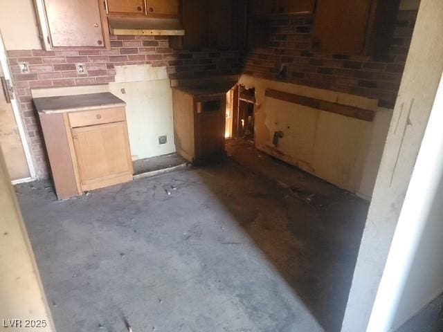 4430 Judson Ave, Las Vegas, NV 89115 - kitchen with unfinished concrete flooring and under cabinet range hood