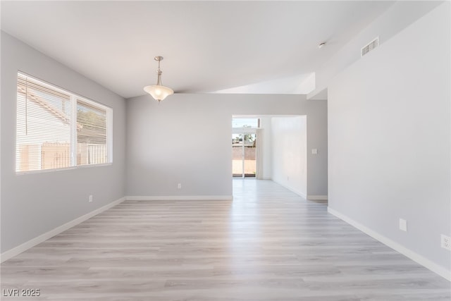 5524 Cleary Ct, Las Vegas, NV 89108 - spare room with light wood-type flooring and lofted ceiling