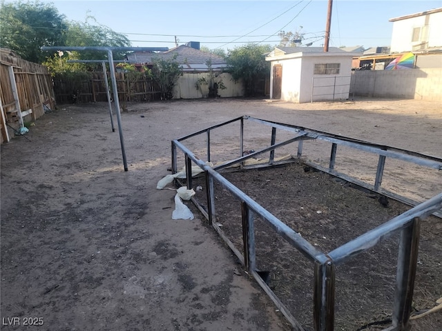 2645 Cedar Ave, Las Vegas, NV 89101 - fenced backyard featuring an outbuilding