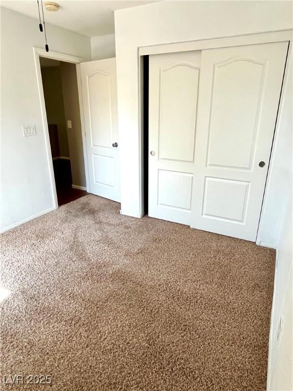 10450 Badger Ravine St, Las Vegas, NV 89178 - unfurnished bedroom with a closet and carpet