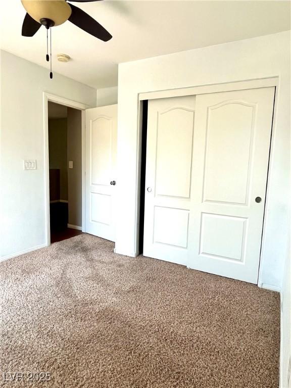 10450 Badger Ravine St, Las Vegas, NV 89178 - unfurnished bedroom featuring carpet floors, a closet, and ceiling fan