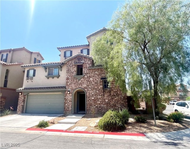10450 Badger Ravine St, Las Vegas, NV 89178 - view of front of house featuring stone siding, stucco siding, concrete driveway, and an attached garage