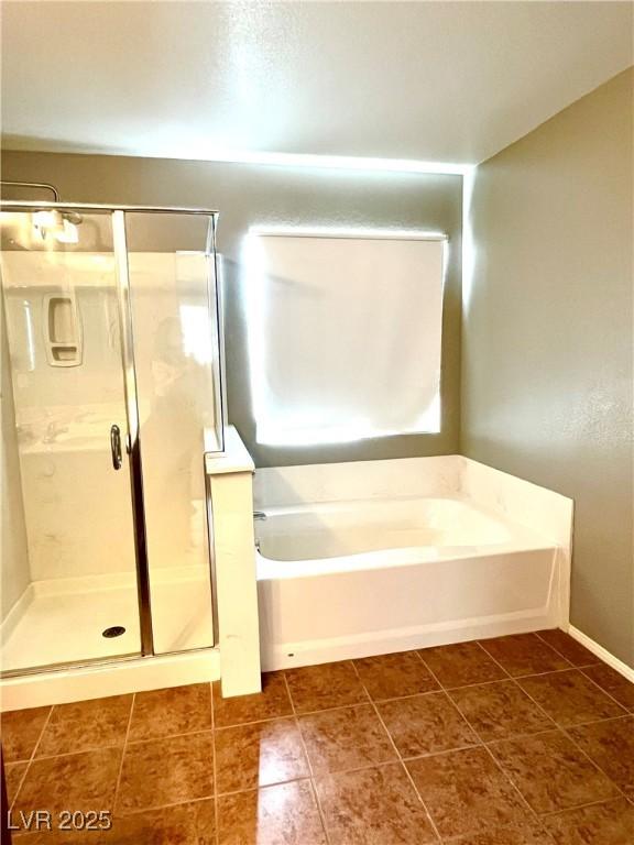 10450 Badger Ravine St, Las Vegas, NV 89178 - full bath with a garden tub, a stall shower, and tile patterned flooring
