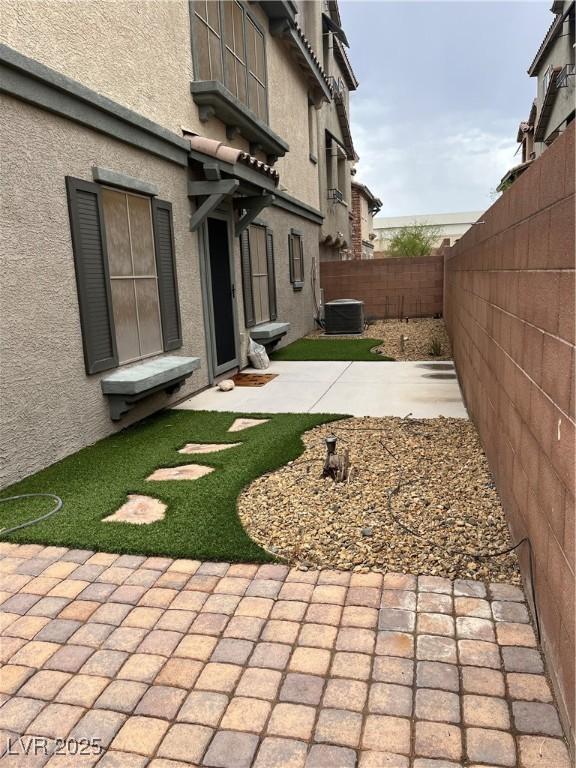 10450 Badger Ravine St, Las Vegas, NV 89178 - fenced backyard featuring a patio area