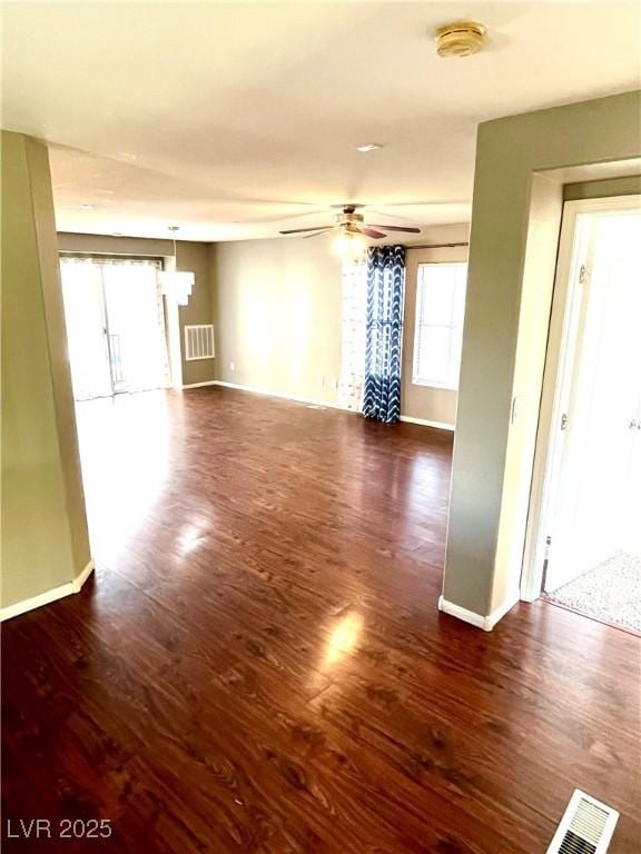 10450 Badger Ravine St, Las Vegas, NV 89178 - unfurnished living room featuring a ceiling fan and wood finished floors