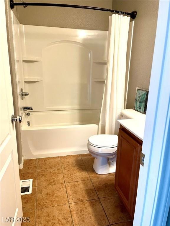 10450 Badger Ravine St, Las Vegas, NV 89178 - bathroom featuring tile patterned floors, vanity, and shower / bath combo with shower curtain