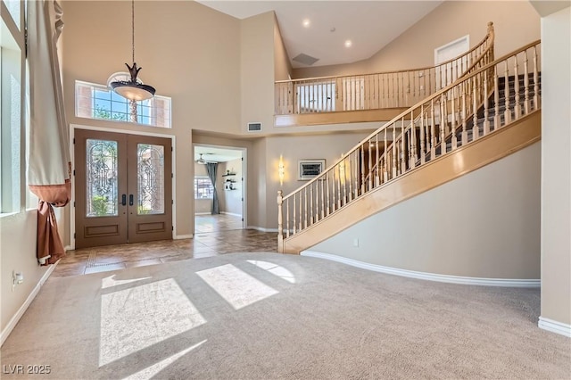 9583 Gainey Ranch Ave, Las Vegas, NV 89147 - foyer with stairway, carpet, french doors, a high ceiling, and recessed lighting