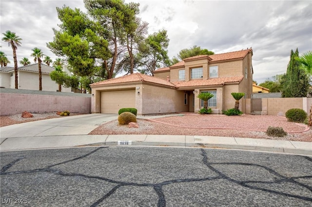9836 Russett Wood Cir, Las Vegas, NV 89117 - mediterranean / spanish-style home featuring a tiled roof, driveway, stucco siding, and a garage