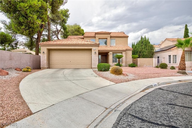 9836 Russett Wood Cir, Las Vegas, NV 89117 - mediterranean / spanish home with a tiled roof, stucco siding, an attached garage, and driveway