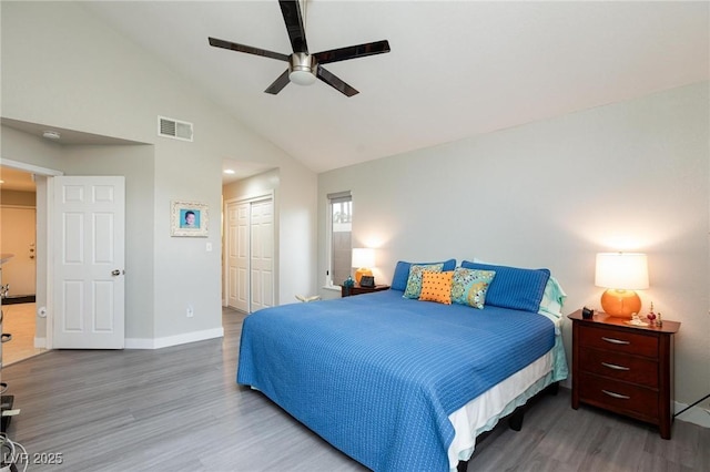 9836 Russett Wood Cir, Las Vegas, NV 89117 - bedroom with wood finished floors, a closet, a ceiling fan, and high vaulted ceiling
