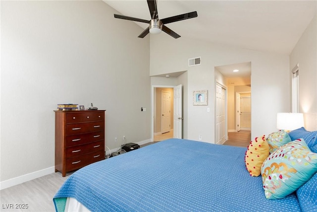 9836 Russett Wood Cir, Las Vegas, NV 89117 - bedroom featuring high vaulted ceiling, light wood-type flooring, and ceiling fan