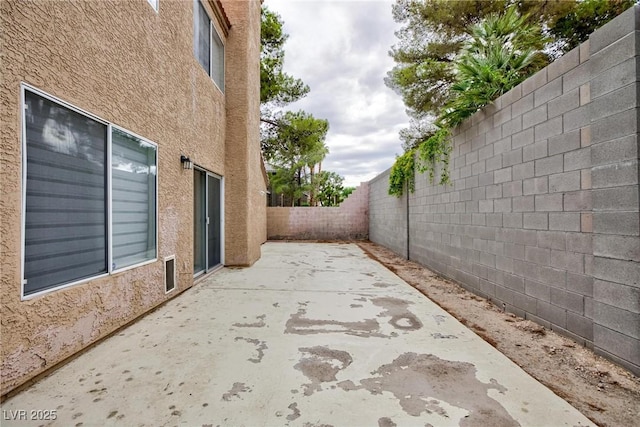 9836 Russett Wood Cir, Las Vegas, NV 89117 - fenced backyard featuring a patio
