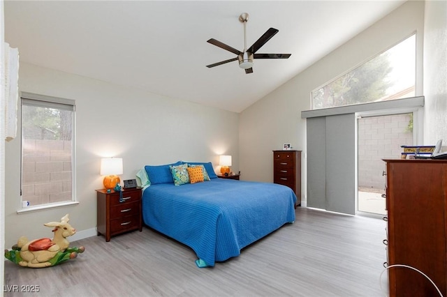 9836 Russett Wood Cir, Las Vegas, NV 89117 - bedroom with wood finished floors, lofted ceiling, and a ceiling fan